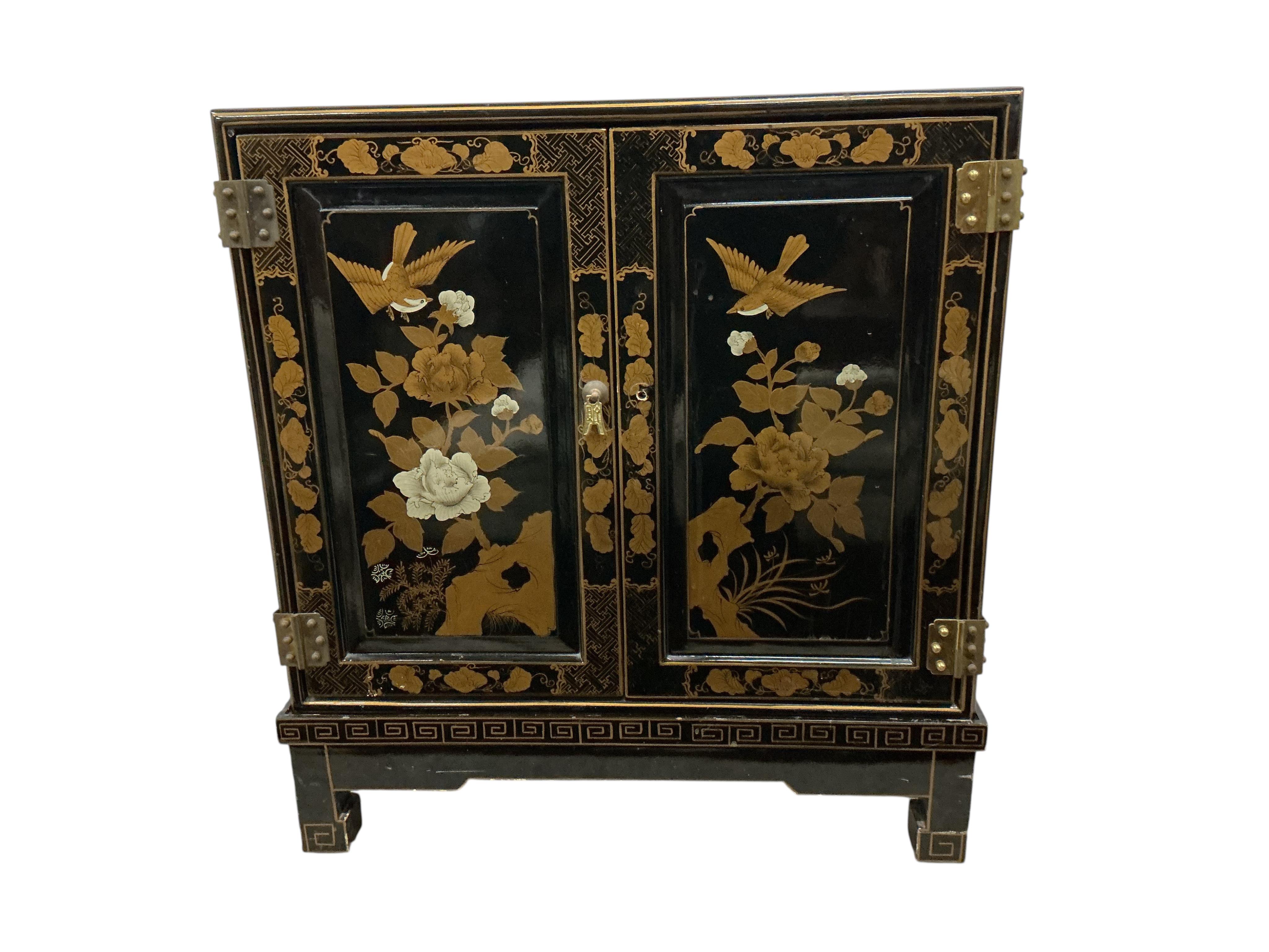 A small Chinese lacquered side cabinet, width 61cm, depth 30cm, height 67cm